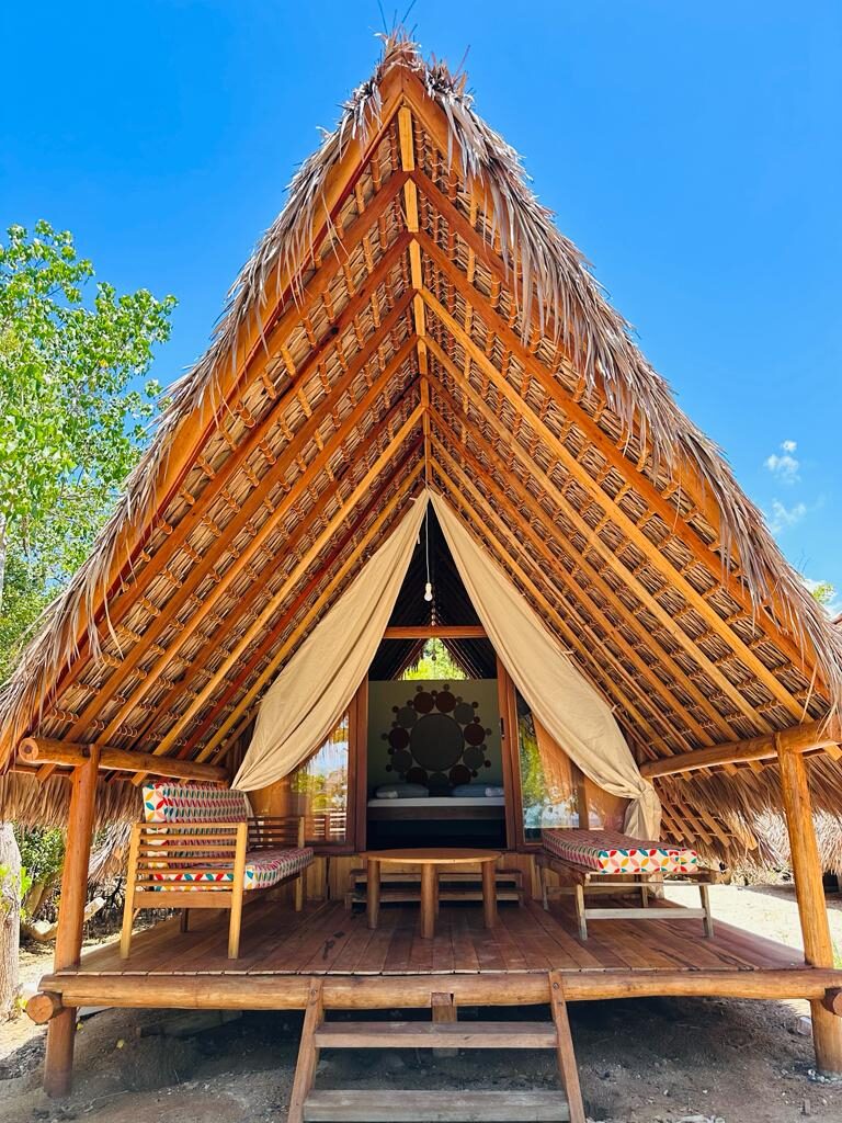 A thatched beach hut