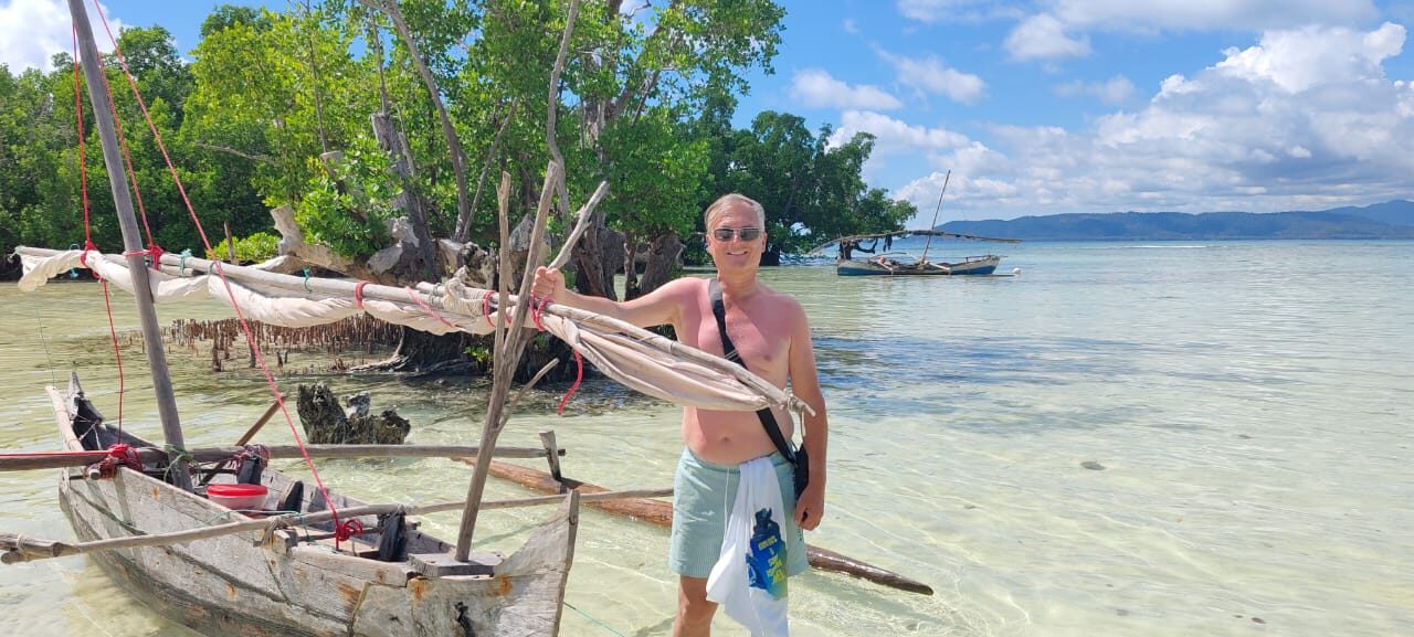 Anthony with a pirogue in the mangroves