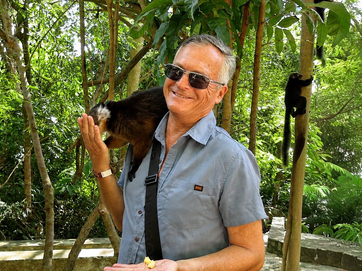 A lemur on Anthony's shoulder