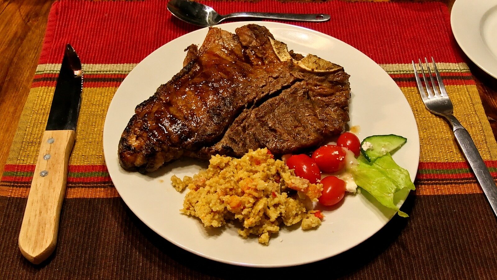 A T-bone steak plated at the lodge