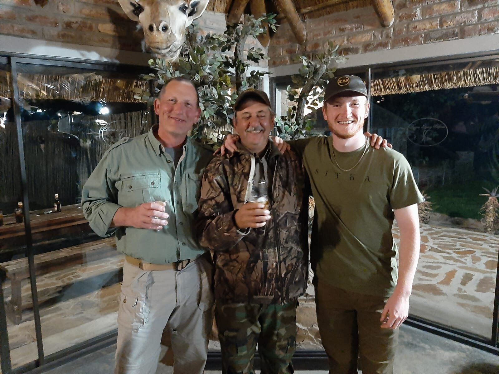 Hunters celebrating together at the lodge