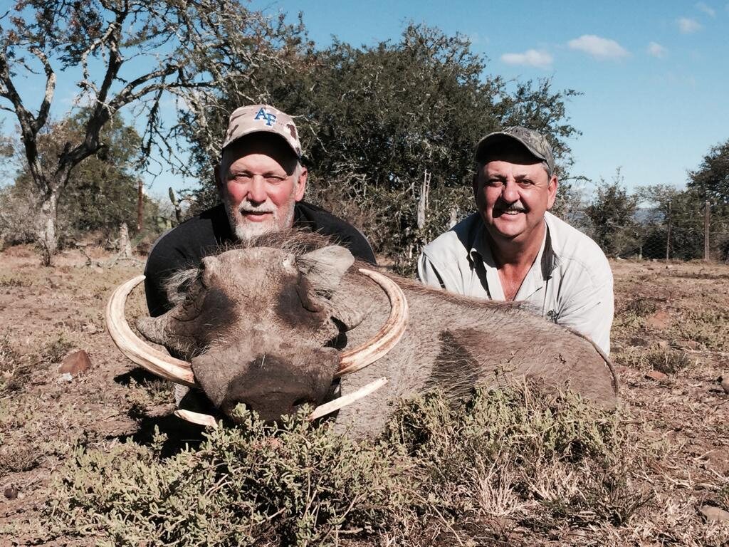 Hunters with a warthog in the Limpopo bushveld