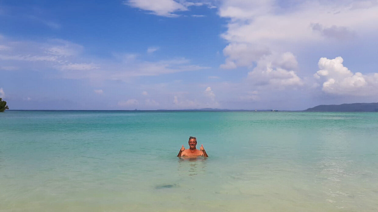 A swimmer in clear shallow water off Nosy Be