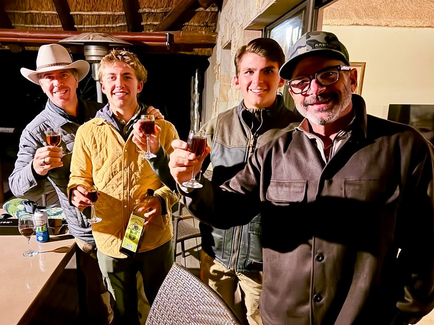Guests raising glasses together at the lodge