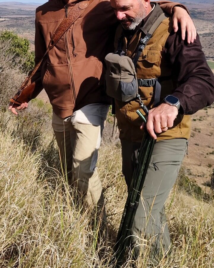 Two hunters in neutral clothing on a stalk