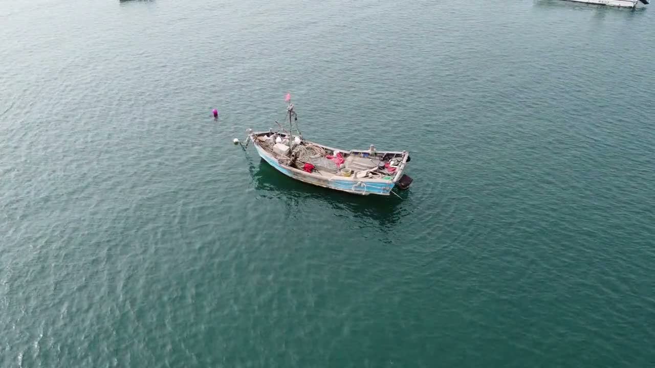 A small boat on calm water off Nosy Be
