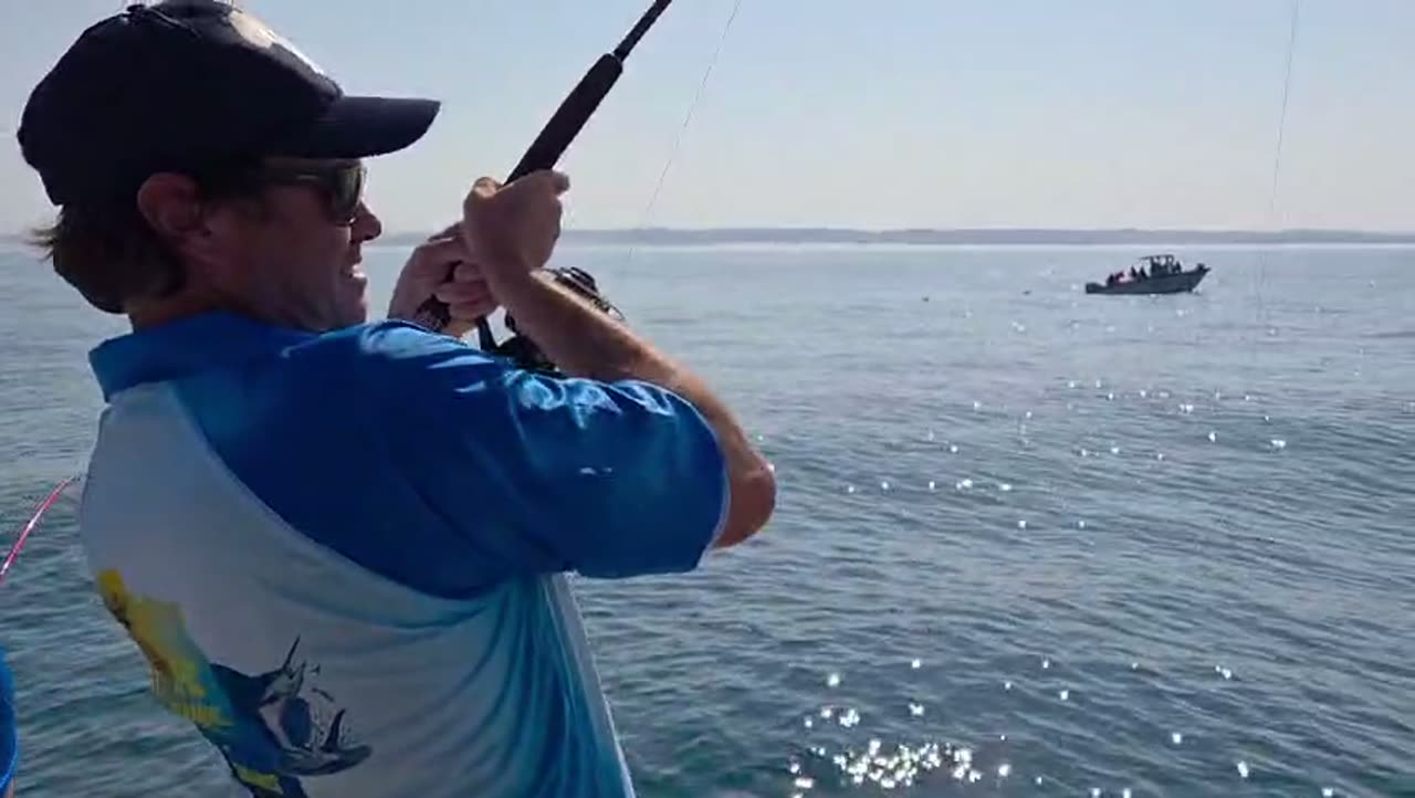 An angler bent into a fish off Nosy Be
