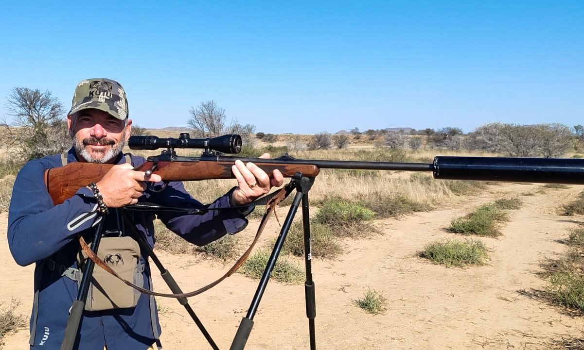 A hunter ready on shooting sticks in the bushveld