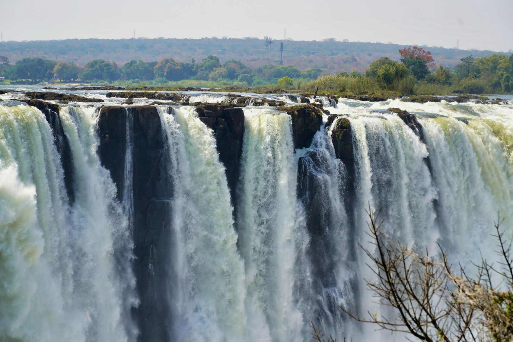 A wide waterfall on the Zambezi River between Zimbabwe and Zambia