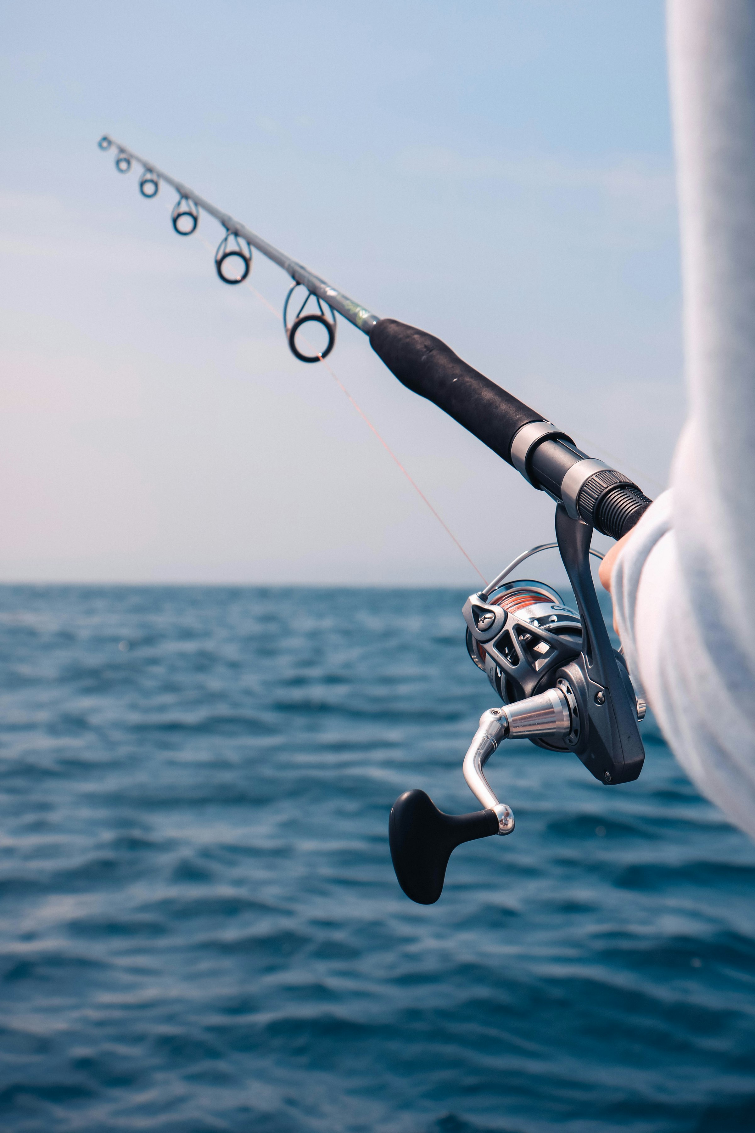 A rod and reel over deep water